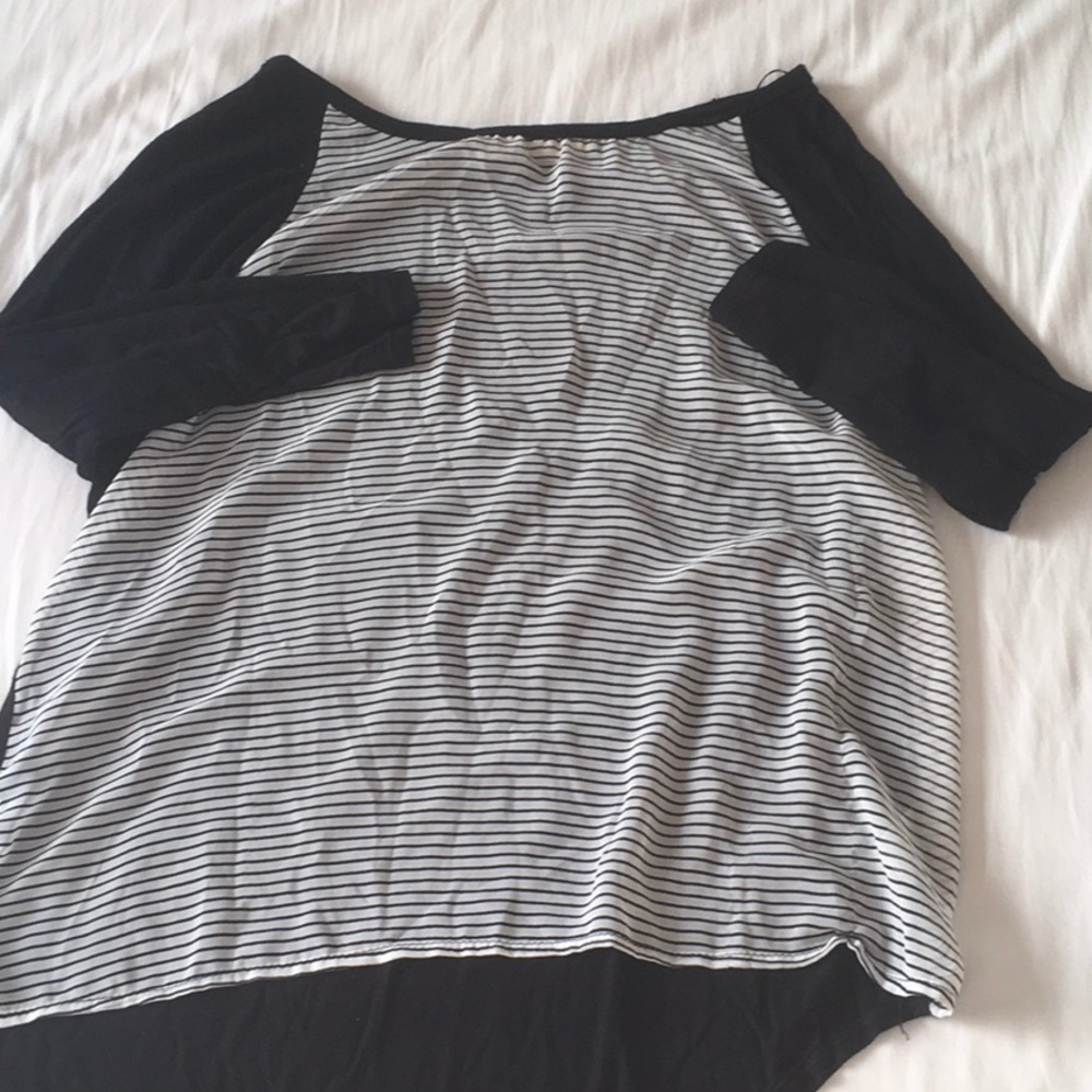 Quarter length sleeves, striped tee shirt.